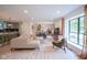 Open floor plan connecting the living room, dining area, and kitchen with ample natural light at 1015 Fox Hill Dr, Indianapolis, IN 46228