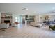 Spacious open-concept living area with hardwood floors, fireplace, and stainless steel appliances at 1015 Fox Hill Dr, Indianapolis, IN 46228