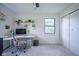 Bright home office featuring a large window, white walls, and modern decor at 1015 Fox Hill Dr, Indianapolis, IN 46228