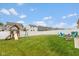 Large backyard featuring a playset, fire pit, and seating area for outdoor fun at 10334 Deercrest Ln, Indianapolis, IN 46239