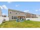 Spacious backyard with well-maintained lawn, fire pit, and privacy fence at 10334 Deercrest Ln, Indianapolis, IN 46239