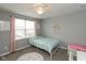 Charming bedroom with unicorn decor, a cozy bed, and natural light from the window at 10334 Deercrest Ln, Indianapolis, IN 46239