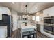 Bright kitchen with white cabinets, granite countertops, stainless steel appliances, and a large island at 10334 Deercrest Ln, Indianapolis, IN 46239