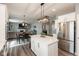 Modern kitchen with stainless appliances, a large island, and open layout into the living area at 10334 Deercrest Ln, Indianapolis, IN 46239