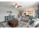 Open-concept living room featuring modern decor and an adjoining kitchen at 10334 Deercrest Ln, Indianapolis, IN 46239