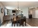 Open-concept living room with a dining area, fireplace, and comfortable seating at 10334 Deercrest Ln, Indianapolis, IN 46239