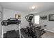 Well-equipped home gym featuring a treadmill, elliptical, and weight training equipment at 10334 Deercrest Ln, Indianapolis, IN 46239