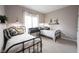 Charming bedroom featuring twin beds with black iron frames and neutral decor at 10707 Burning Ridge Ln, Fishers, IN 46037