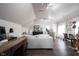 Spacious bonus room with hardwood floors, neutral sofa, and desk area with natural light at 10707 Burning Ridge Ln, Fishers, IN 46037