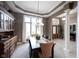 Elegant dining room with coffered ceilings, chandelier, and hutch at 10707 Burning Ridge Ln, Fishers, IN 46037