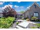 Beautiful home featuring a meticulously landscaped front yard with a fountain and covered entrance at 10707 Burning Ridge Ln, Fishers, IN 46037