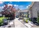 Charming home with a beautifully landscaped front yard, water fountain, and inviting entrance at 10707 Burning Ridge Ln, Fishers, IN 46037