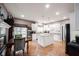 Bright kitchen with white cabinets, granite counters, and hardwood floors at 10707 Burning Ridge Ln, Fishers, IN 46037