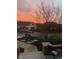 Street view of a suburban home with a beautiful sunset at 10707 Burning Ridge Ln, Fishers, IN 46037