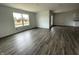 Open-concept living room with durable floors and bright natural light, perfect for entertaining and relaxation at 1175 Mcbride St, Greenfield, IN 46140