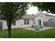 Backyard with a patio, swing, and green grass surrounded by a fence at 12389 Titans Dr, Fishers, IN 46037
