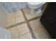 Close-up of bathroom floor featuring tile design and toilet at 12389 Titans Dr, Fishers, IN 46037