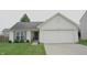 Attractive single-story house featuring a neatly maintained lawn and an attached garage at 12389 Titans Dr, Fishers, IN 46037