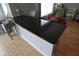 Spacious kitchen island featuring a granite countertop with barstool seating at 12389 Titans Dr, Fishers, IN 46037
