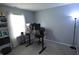 Home office featuring adjustable height desk, monitors, and a bright window at 12389 Titans Dr, Fishers, IN 46037