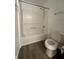 Bathroom with a tub and shower combo, toilet, updated fixtures, and neutral walls at 12639 Justice Xing, Fishers, IN 46037