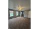 Large bedroom with neutral walls, carpeting, ceiling fan, and multiple windows for lots of natural light at 12639 Justice Xing, Fishers, IN 46037