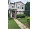 Inviting two-story home with lush green lawn, walkway, and tasteful landscaping at 12639 Justice Xing, Fishers, IN 46037