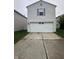 Two car garage with driveway and traditional home exterior at 12639 Justice Xing, Fishers, IN 46037