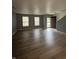 Bright and airy living room with neutral walls and stylish, wood-look flooring at 12639 Justice Xing, Fishers, IN 46037