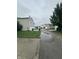 Quiet suburban street view with single-Gathering homes on a cloudy day at 12639 Justice Xing, Fishers, IN 46037