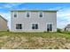 The home features a spacious backyard with green grass, perfect for outdoor activities and summer fun with Gathering and friends at 1571 N Creekwater Pass, Greenfield, IN 46140