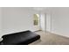 Minimalist bedroom with carpet flooring, a window, and white walls at 1571 N Creekwater Pass, Greenfield, IN 46140