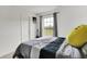 Cozy bedroom featuring a bed, window, decorative curtains, and accent decor at 1571 N Creekwater Pass, Greenfield, IN 46140