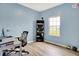 Bright office featuring a window view, desk, shelving unit, and minimalist design at 1571 N Creekwater Pass, Greenfield, IN 46140