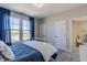 Cozy bedroom with natural light, showcasing a comfortable bed and a serene atmosphere at 16067 Meadow Frost Ct, Fishers, IN 46037
