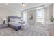 Serene main bedroom with tray ceiling, carpeted floors, and bright windows offering a peaceful retreat at 16067 Meadow Frost Ct, Fishers, IN 46037