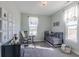 Charming Bedroom with a crib, rocking chair, and decorative wall art, filled with natural light at 16067 Meadow Frost Ct, Fishers, IN 46037