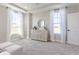 Bedroom featuring bright windows, decorative furniture, and light carpet with modern design at 16067 Meadow Frost Ct, Fishers, IN 46037