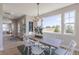 Dining room features light wood floors and large windows, providing ample natural light at 16067 Meadow Frost Ct, Fishers, IN 46037