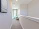 Inviting hallway with view to playroom, enhancing the home's appeal for families at 16067 Meadow Frost Ct, Fishers, IN 46037