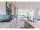 Modern kitchen featuring stainless steel appliances, tile backsplash, and an island with barstool seating at 16067 Meadow Frost Ct, Fishers, IN 46037