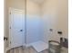 Functional laundry room with a door, modern flooring and fixtures, and ample space at 16067 Meadow Frost Ct, Fishers, IN 46037