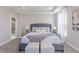Bright main bedroom featuring a comfortable bed, a view to the bathroom, and large windows at 16067 Meadow Frost Ct, Fishers, IN 46037