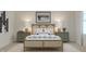 Stylish bedroom with a light wood frame bed, patterned pillows, and modern bedside tables at 16906 Daly Dr, Noblesville, IN 46062