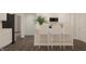 Modern kitchen featuring white cabinets, stainless steel appliances, and counter seating at 16906 Daly Dr, Noblesville, IN 46062