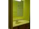 Bright bathroom with a single sink vanity, mirror, and tiled shower at 1808 Orchid Ct, Indianapolis, IN 46219
