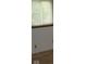 A Bedroom with a large window providing view of the yard at 1808 Orchid Ct, Indianapolis, IN 46219