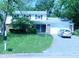 Charming two-story home with a well-manicured lawn and an attached garage at 1808 Orchid Ct, Indianapolis, IN 46219