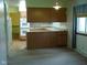 Galley kitchen featuring modern appliances and a serving hatch at 1808 Orchid Ct, Indianapolis, IN 46219