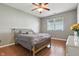 Comfortable bedroom featuring hardwood floors, a large window, and neutral décor at 19489 Prairie Crossing Dr, Noblesville, IN 46062